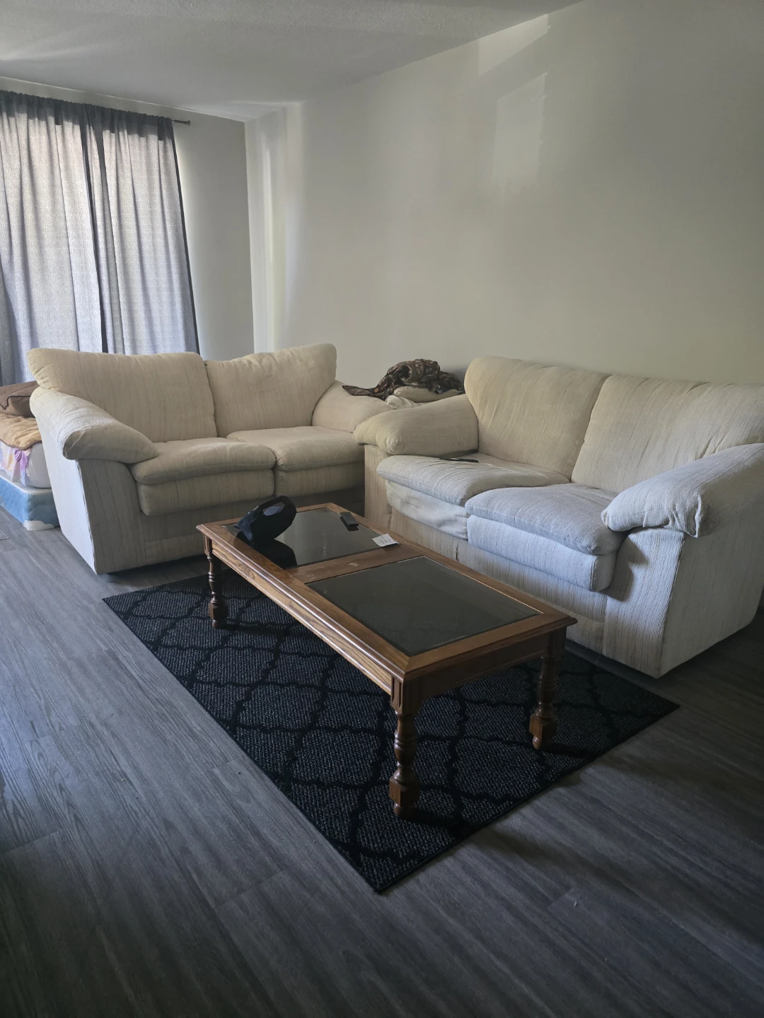 Sofa and Coffee Table Set along with a bed and dining table