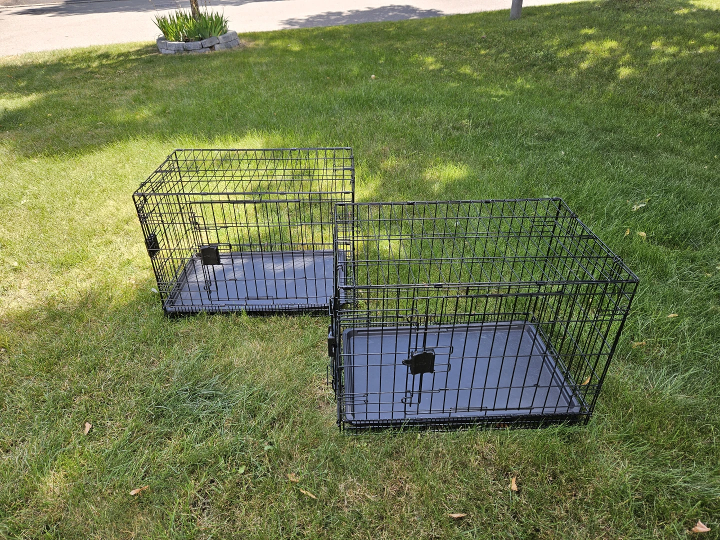 Two Black Metal Dog Crates