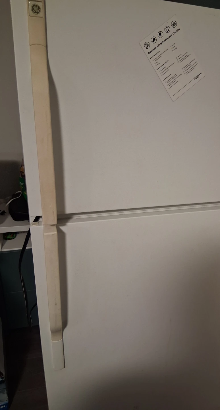 Polar Water Dispenser and White GE refrigerator.
