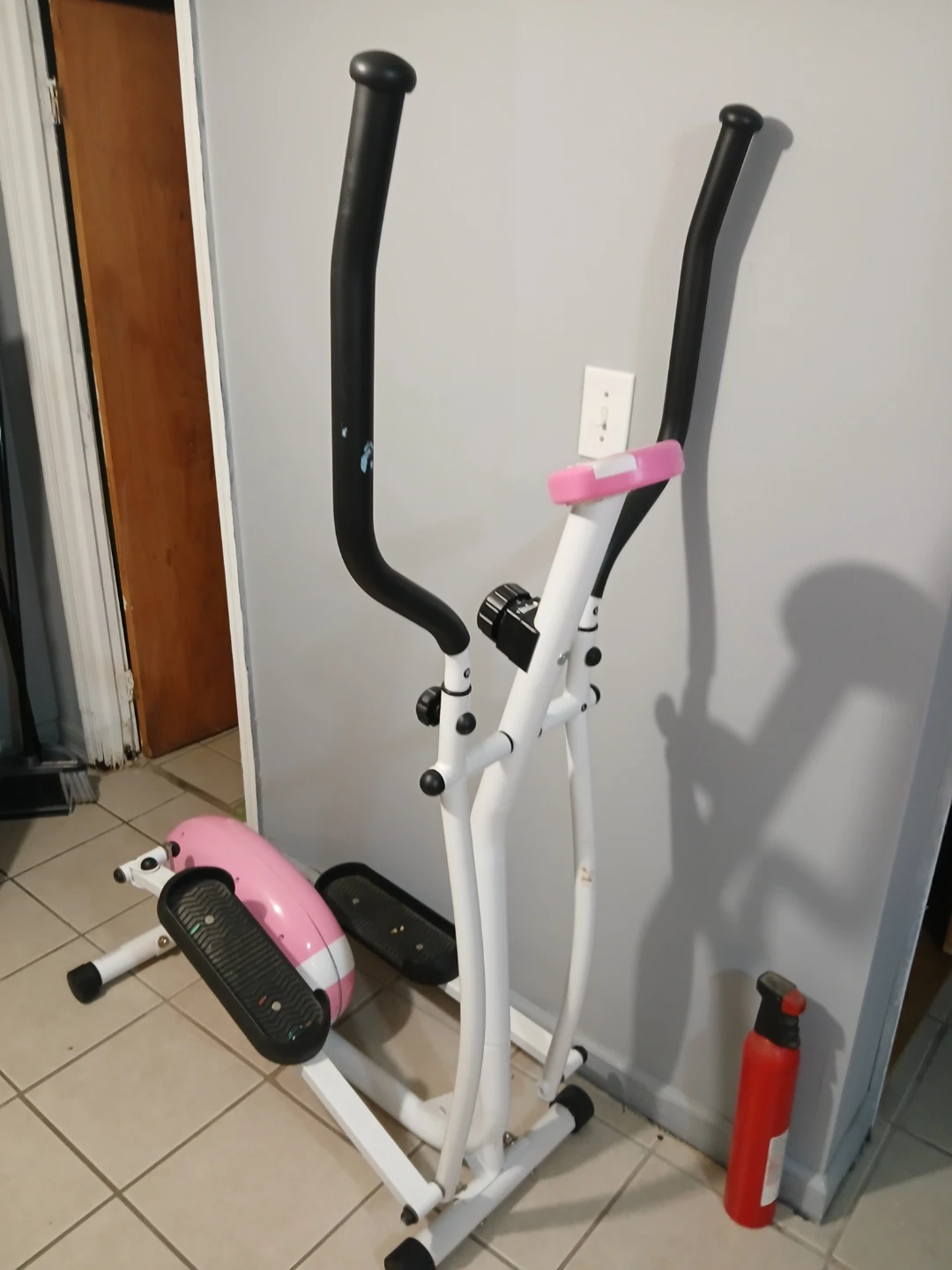White and Pink Elliptical Machine