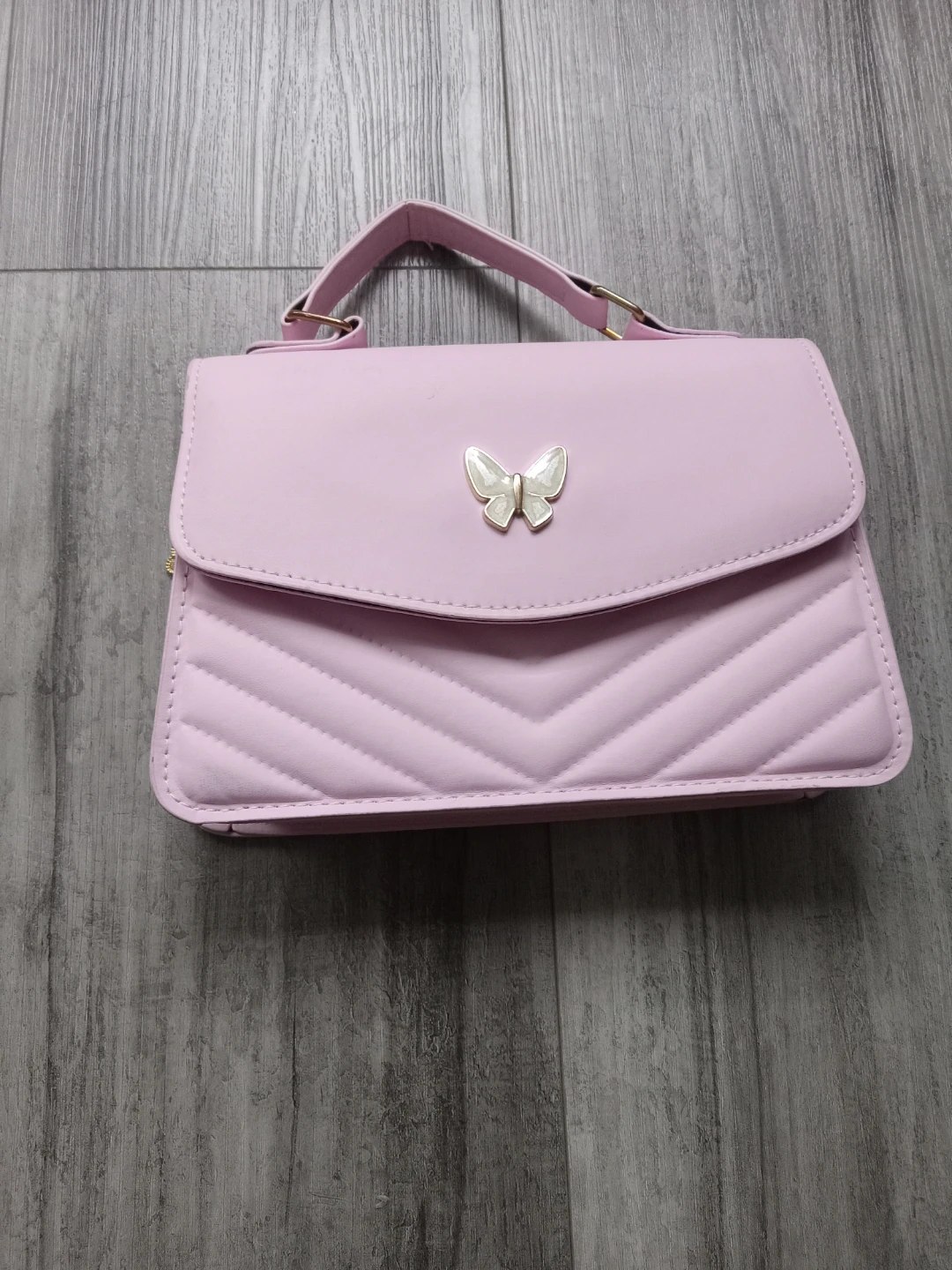 Pink purse with butterfly detail