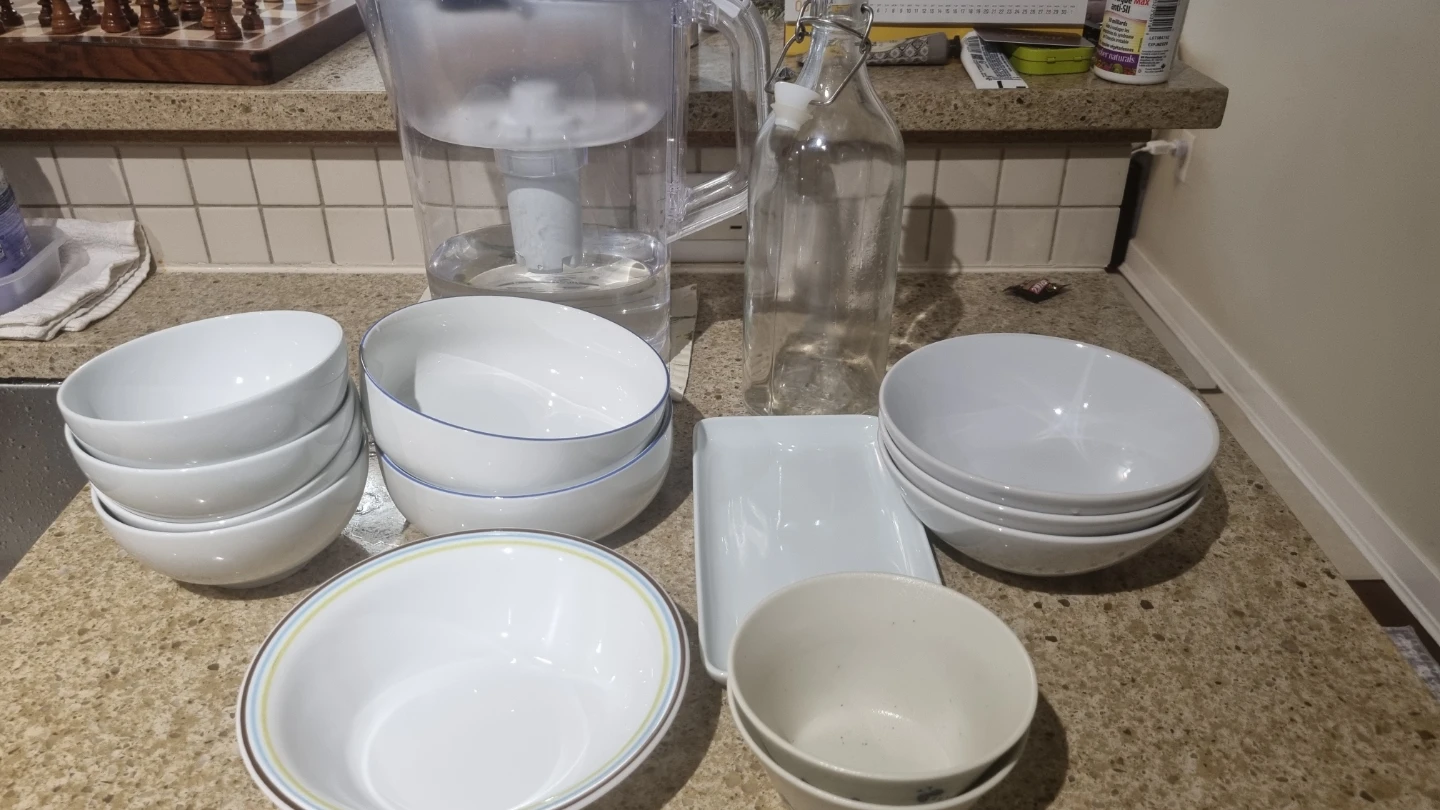 White Ceramic Bowls, Glass Bottle, and Water Pitcher Set