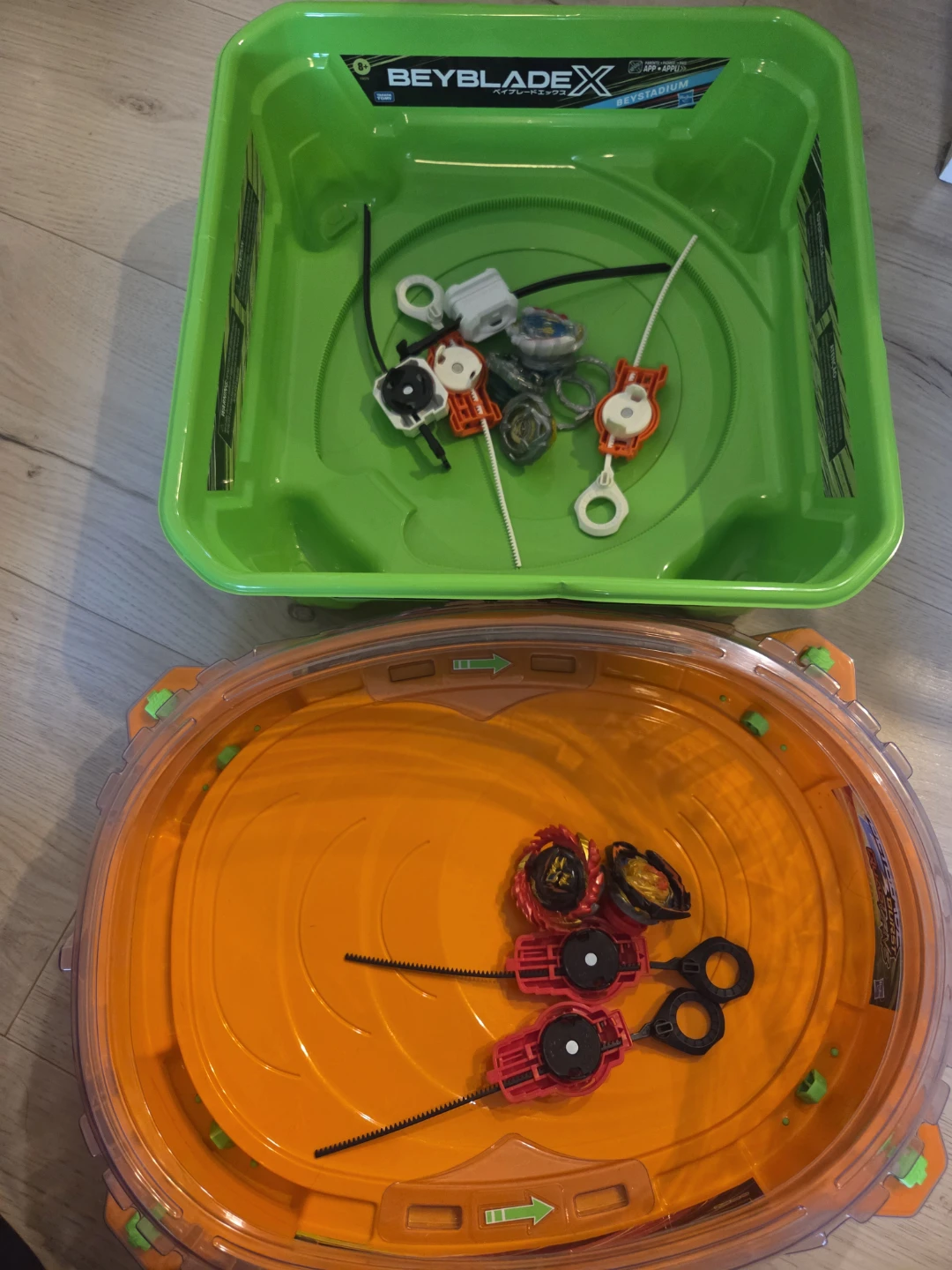 Beyblade X and Burst Stadiums with Beyblades and Launchers