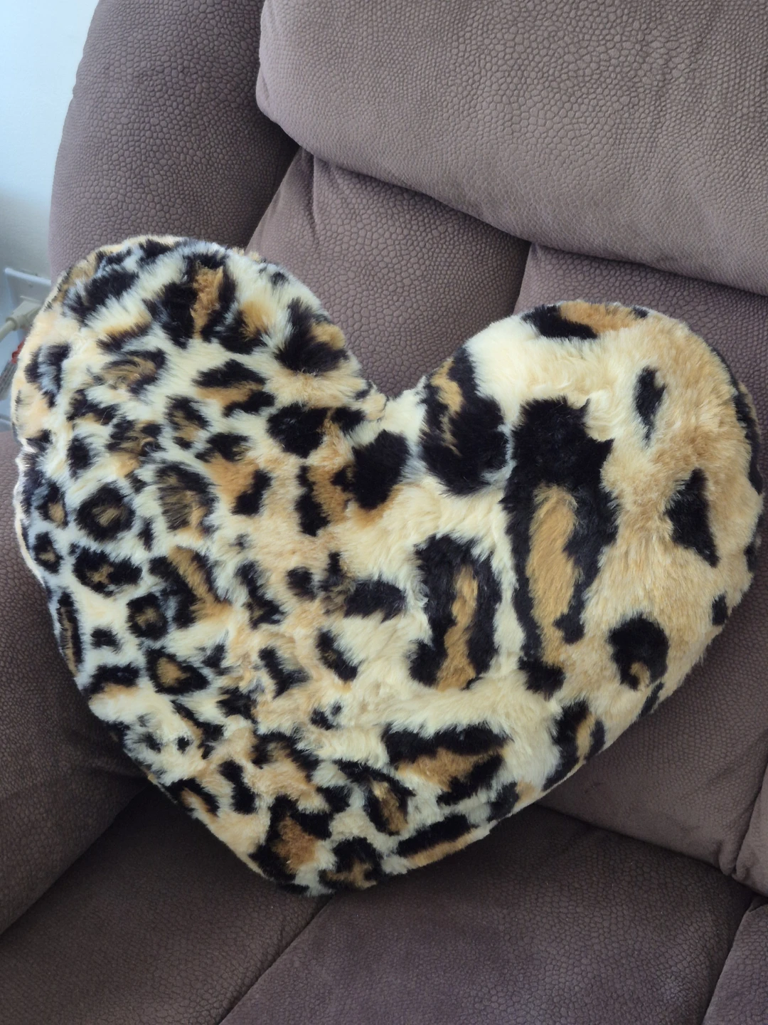 Heart-shaped faux fur throw pillow