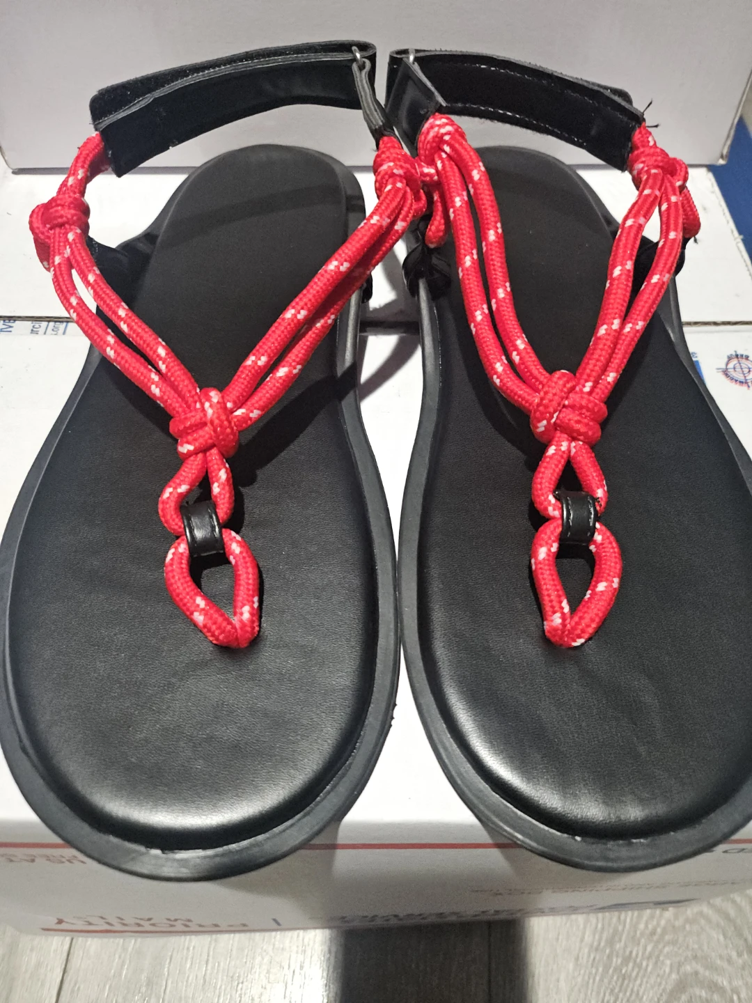 Black Flip-Flop Sandals with Red Rope Accents