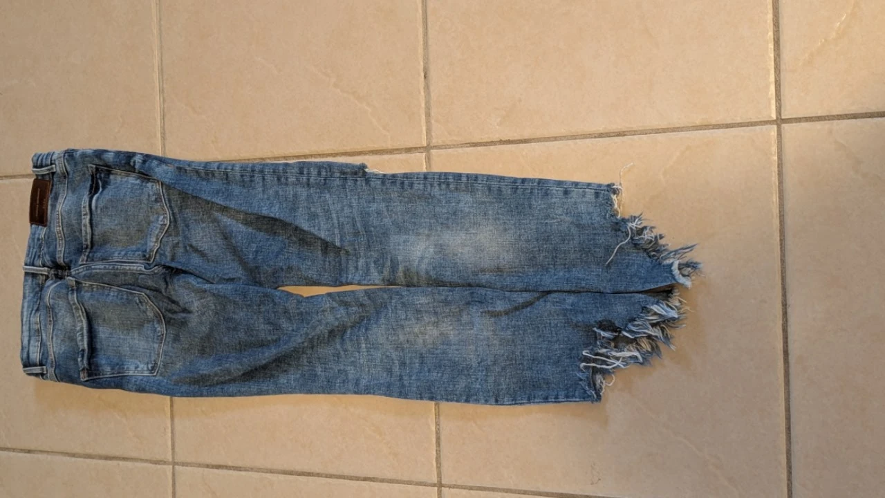 Zara Distressed Mid-Wash Jeans with Raw Frayed Hem - photo 3