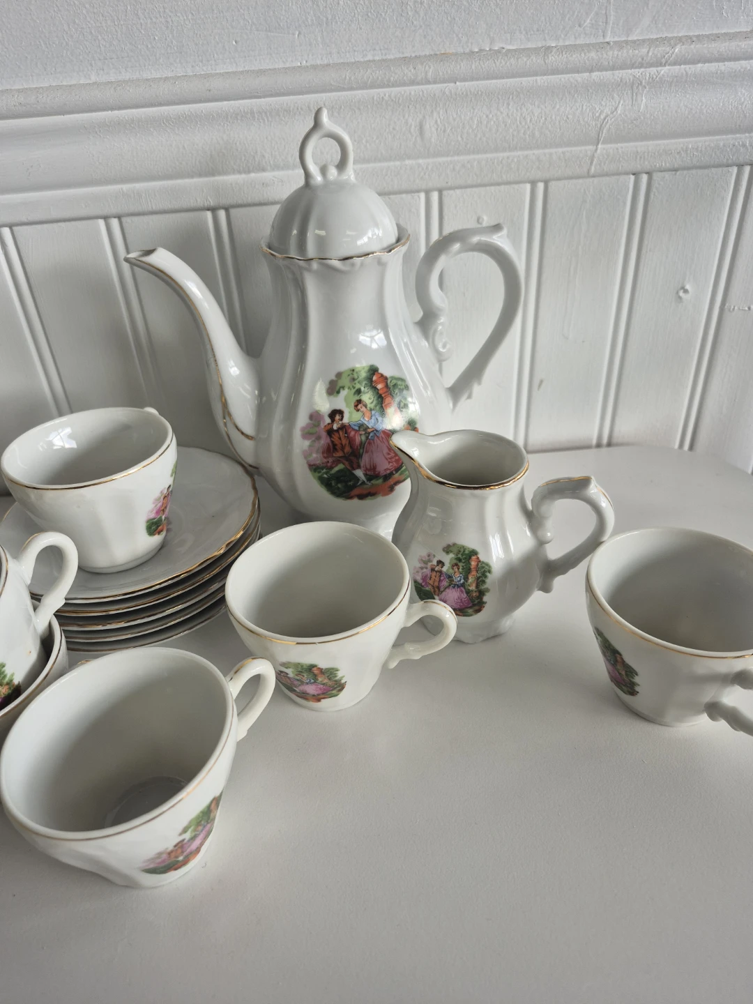 White Teapot Set with Romantic Scene Design