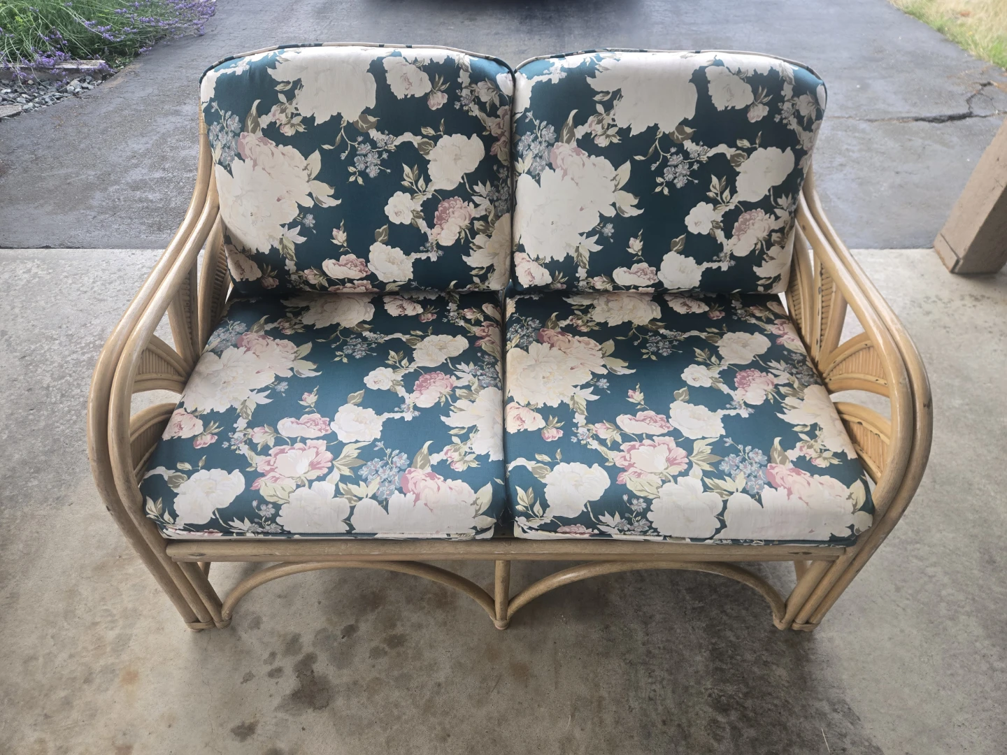Rattan Loveseat with Floral Cushions