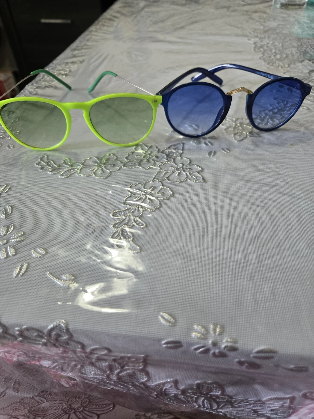 2 pairs of sunglasses, neon green and blue
