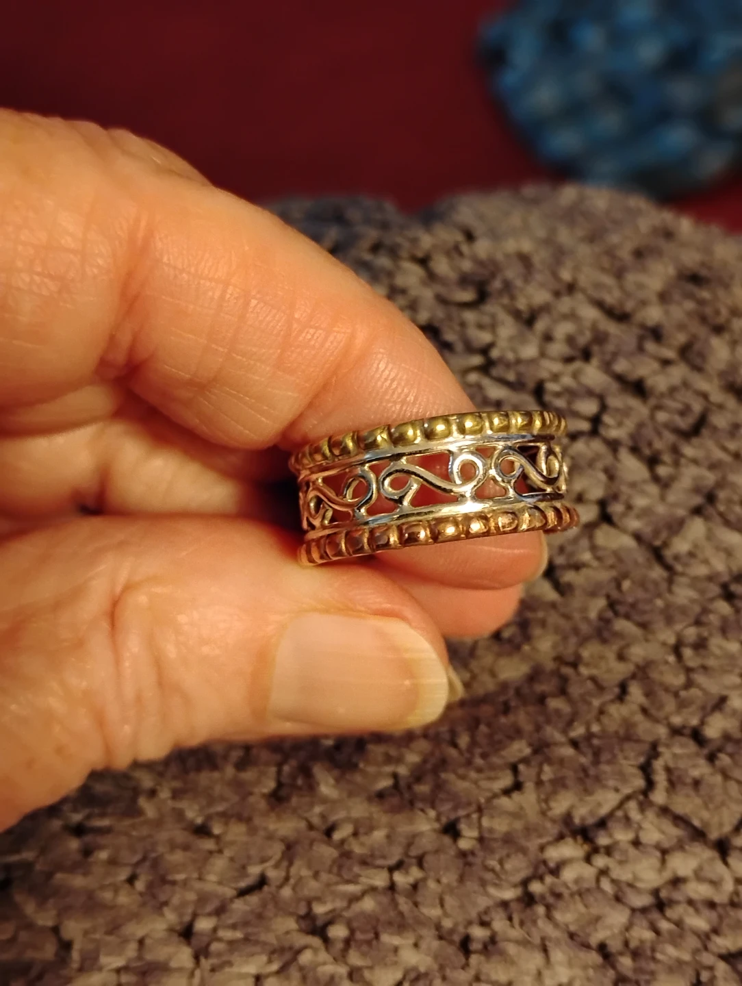 Silver filigree ring with gold accents