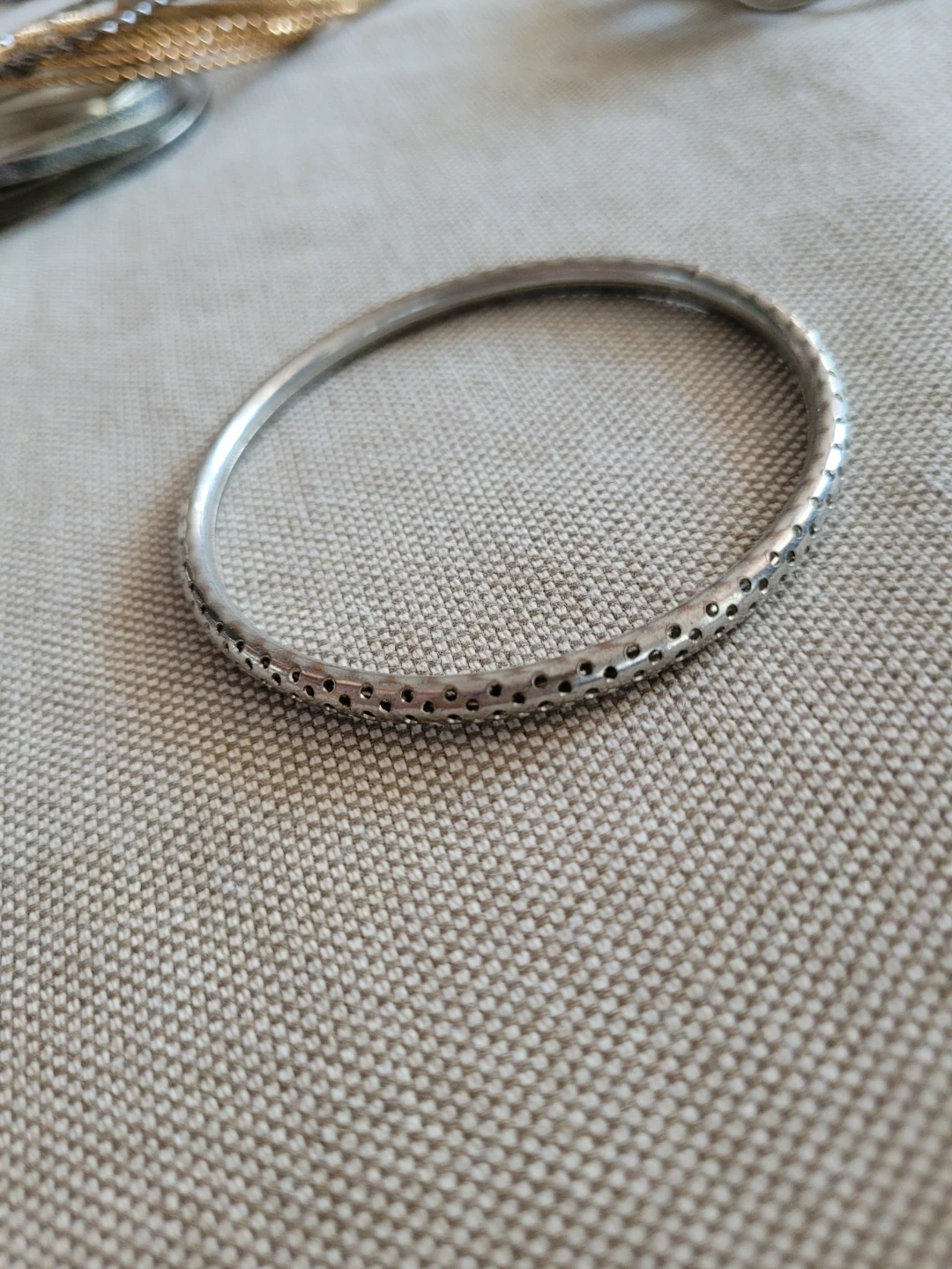 Silver Tone Bangle Bracelet with Perforated Detail