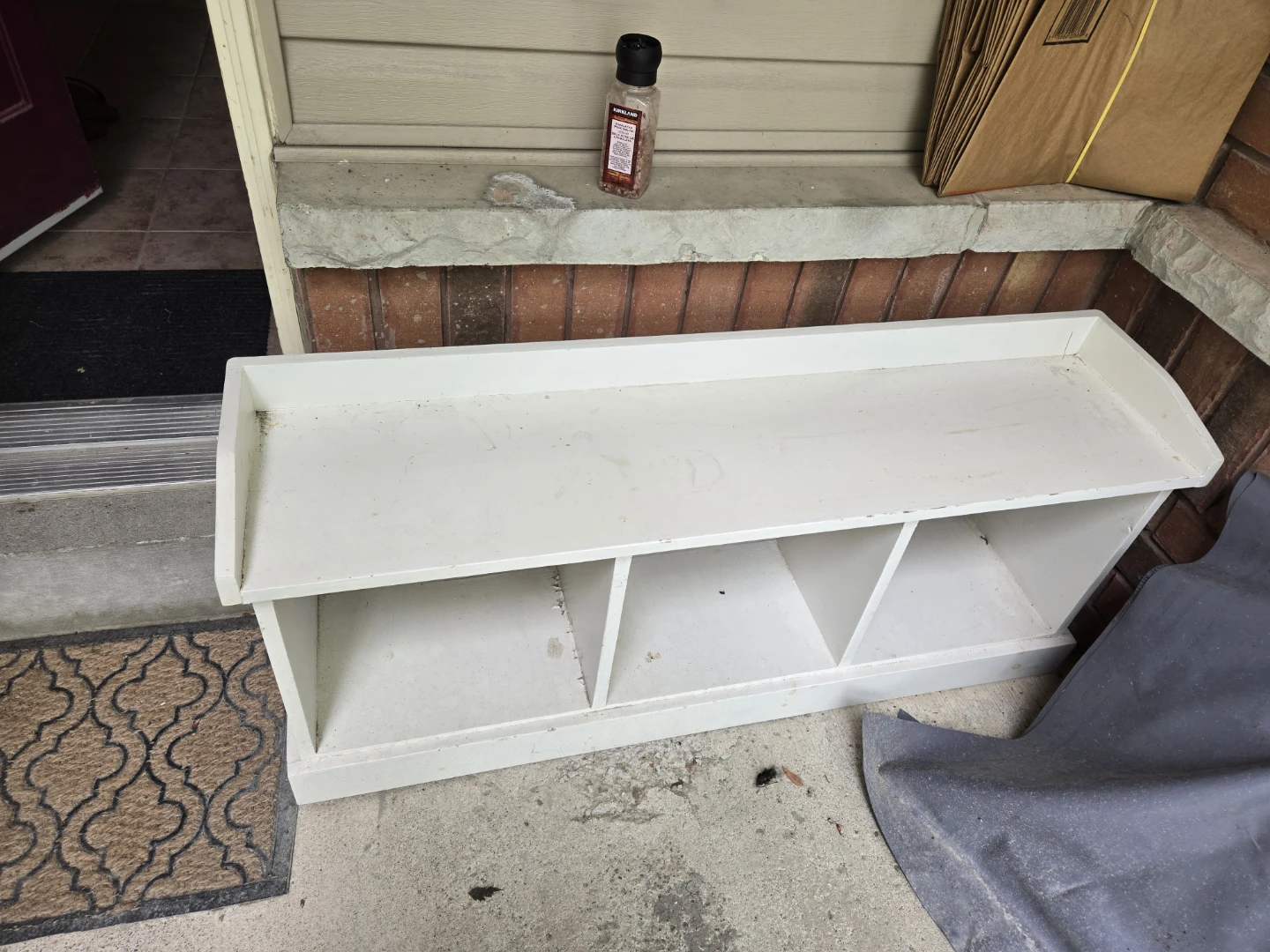 White entryway bench with 3 cubbies