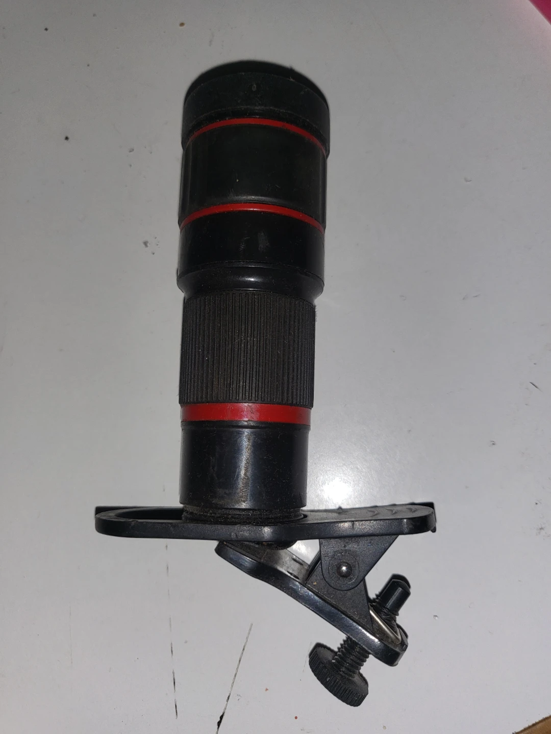 Black zoom lens with clip