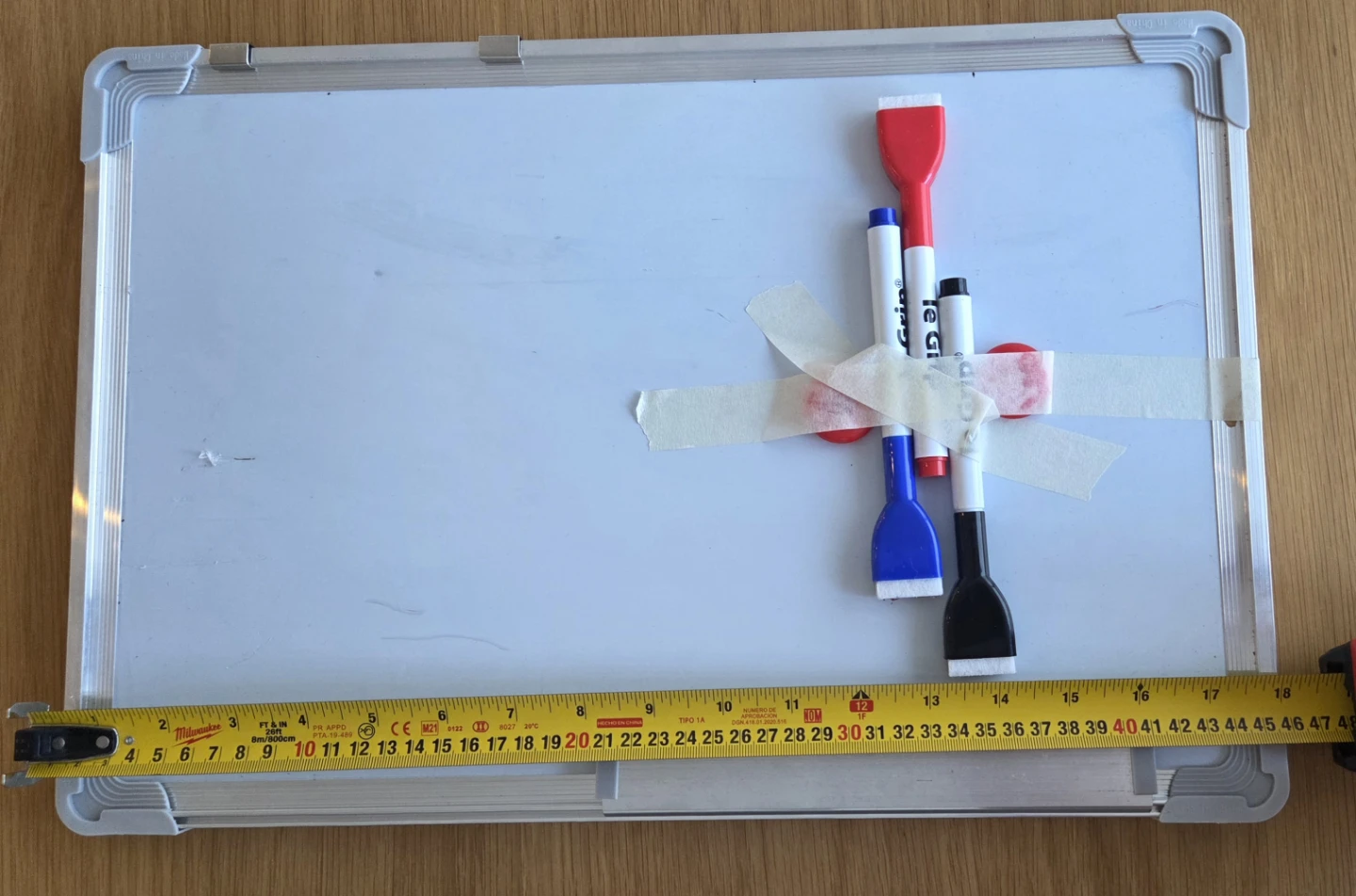 Whiteboard with Markers and Erasers