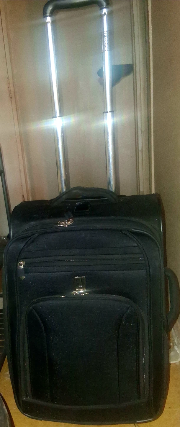 Travelpro Black Rolling Suitcase Adjustable Handle on Wheels