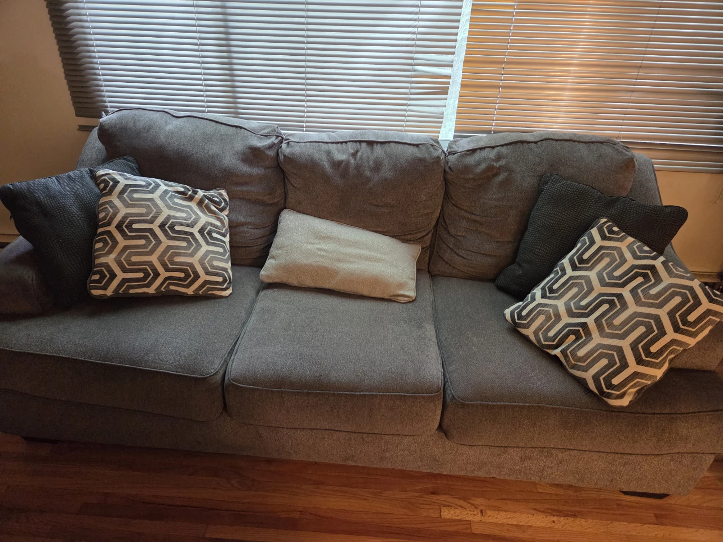 Grey Three-Seater Sofa with pillows