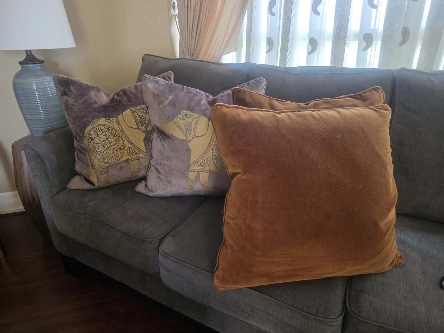 Throw Pillows with Elephant Design and Solid Orange