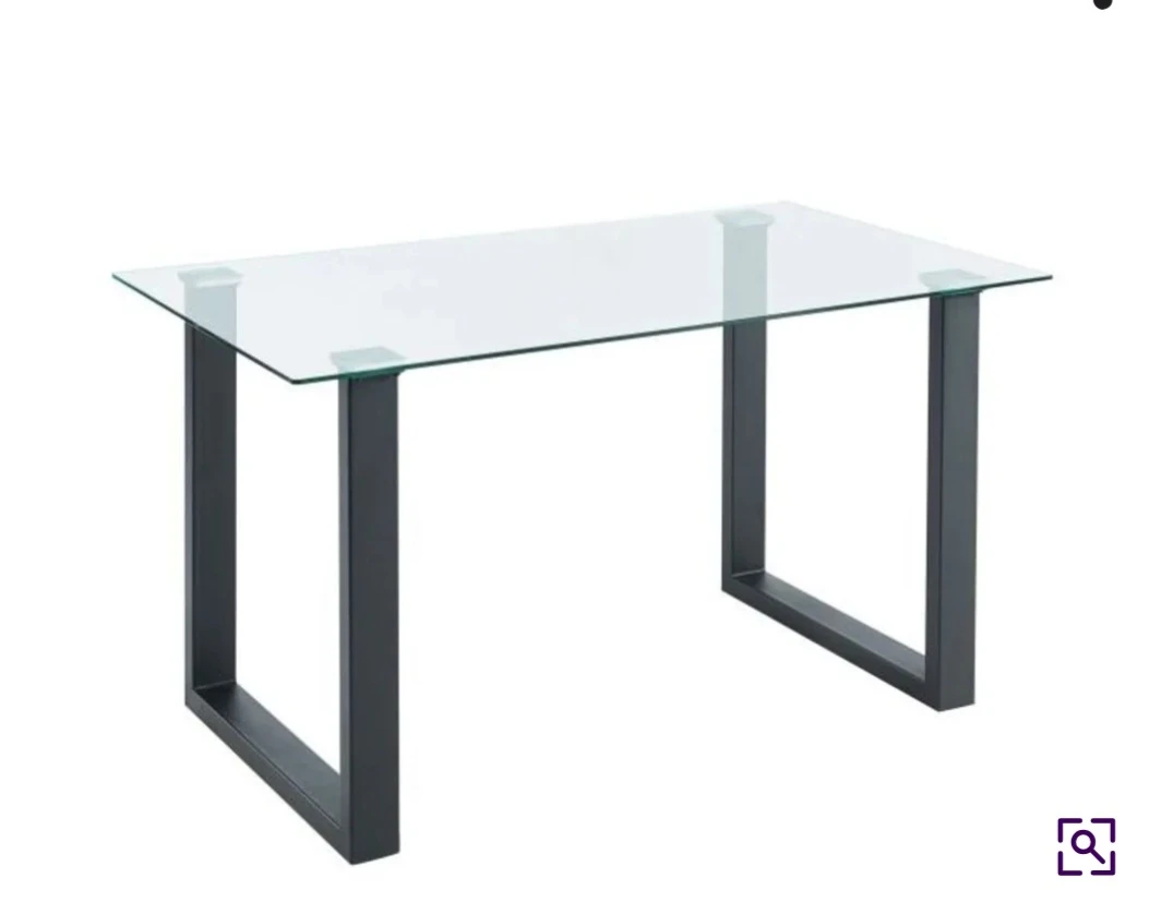 Glass top table with dark metal legs