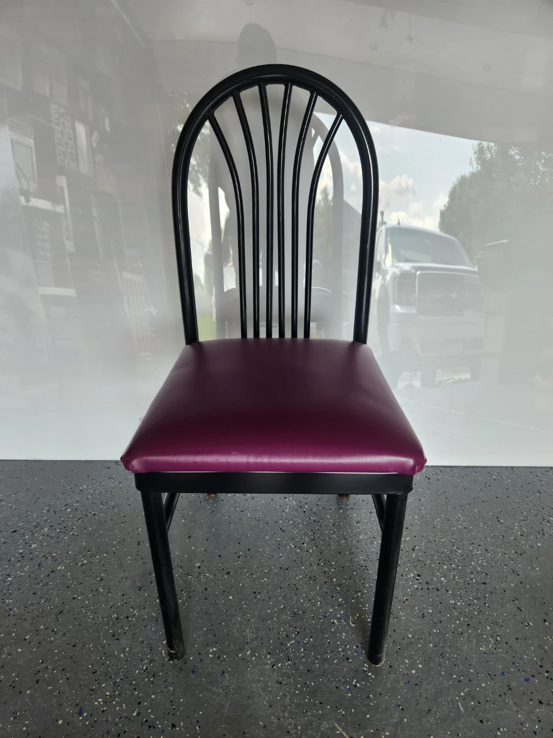 Black metal dining chair with purple seat