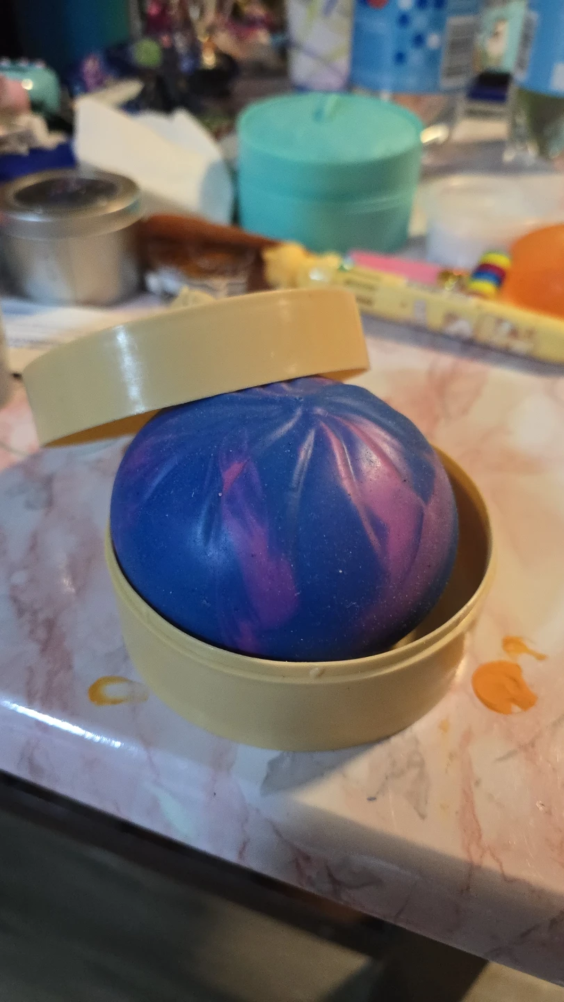 Blue and Pink Swirl Bath Bomb in Yellow Container