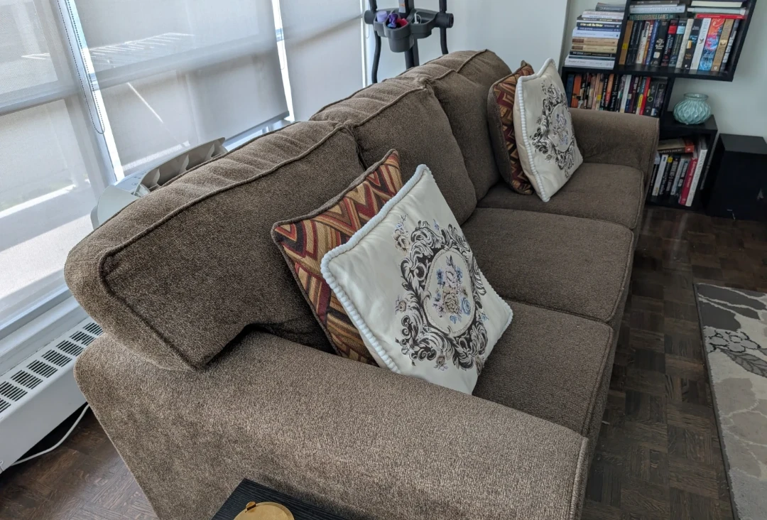 Leon's Brown upholstered couch with decorative pillows - photo 3