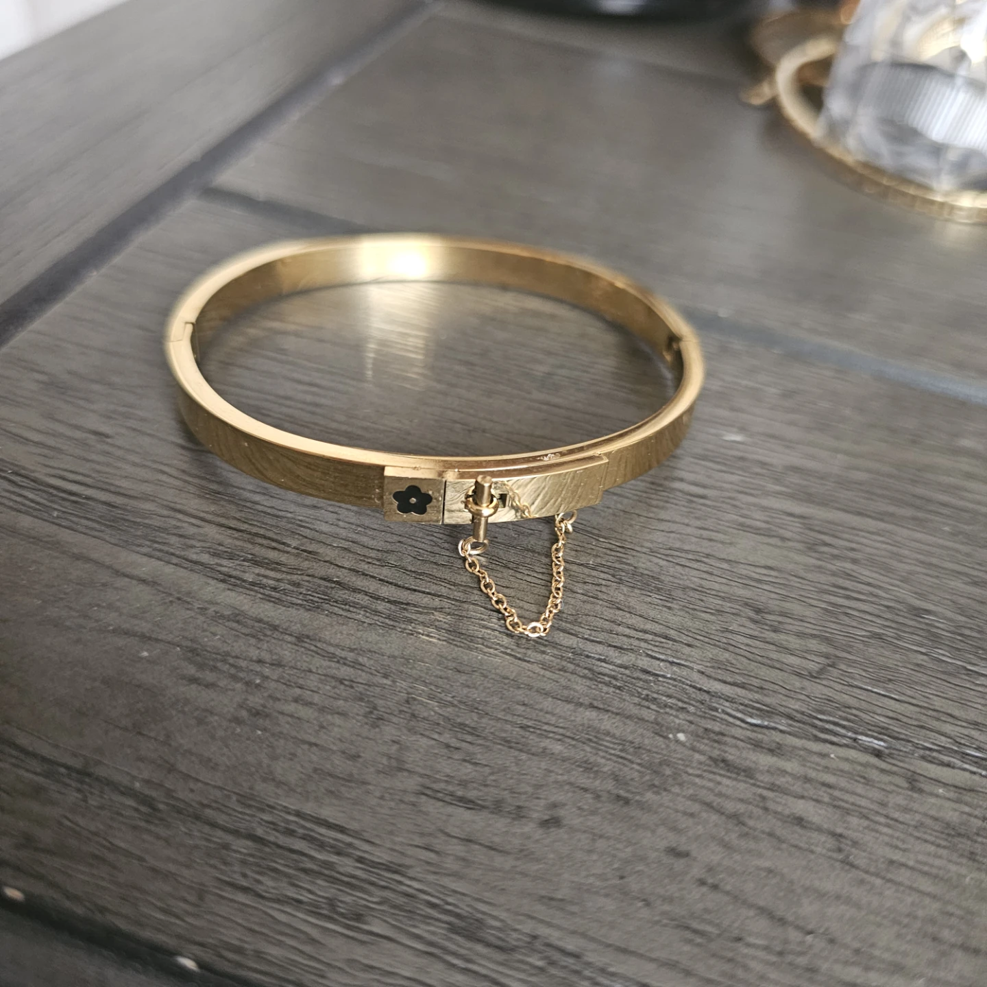 Gold-tone Bangle Bracelet with Flower Detail