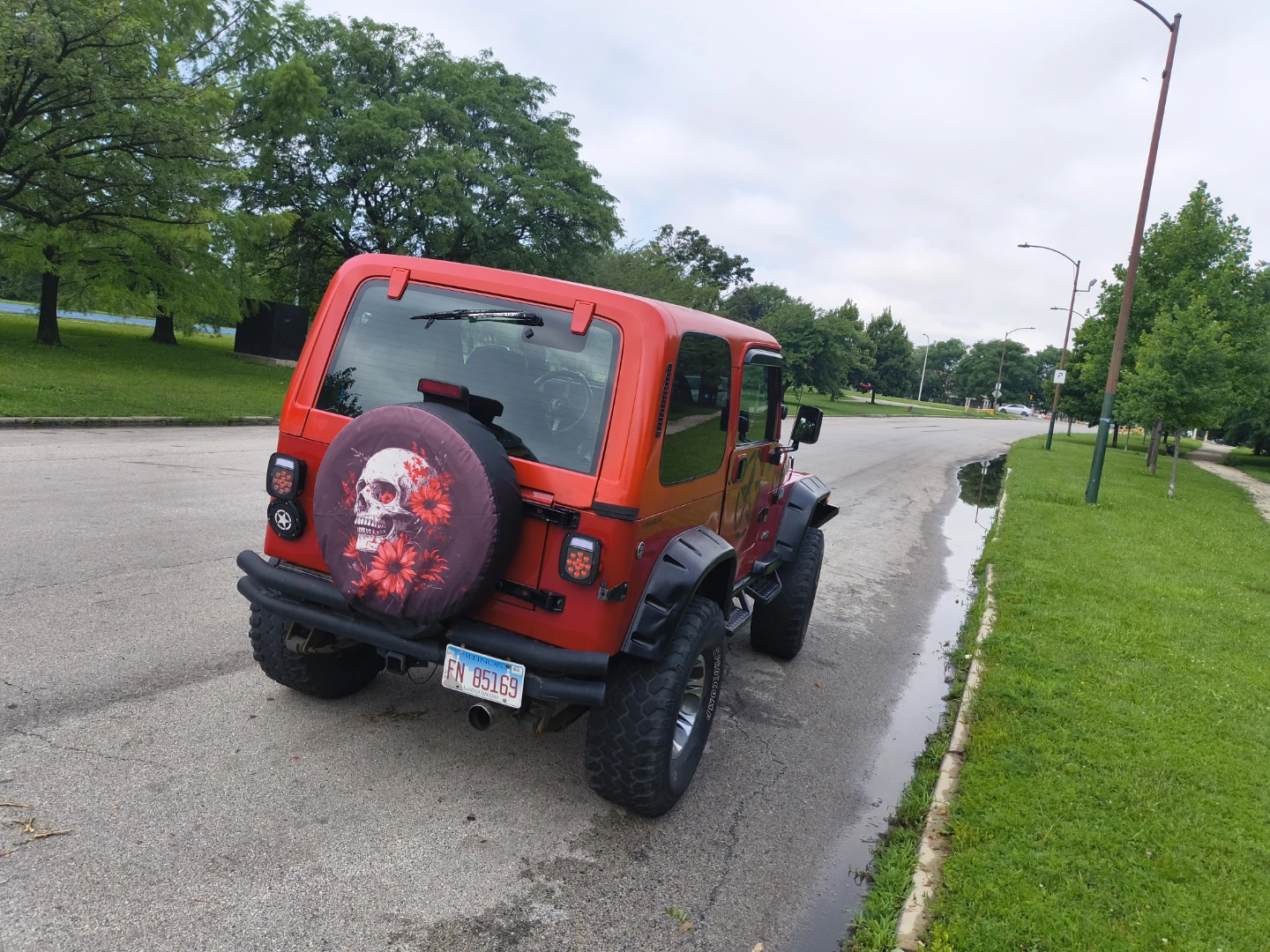 Red Jeep Wrangler with Custom Spare Tire Cover - photo 2