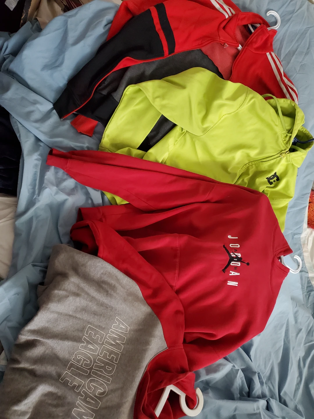 Assortment of brand name sweaters