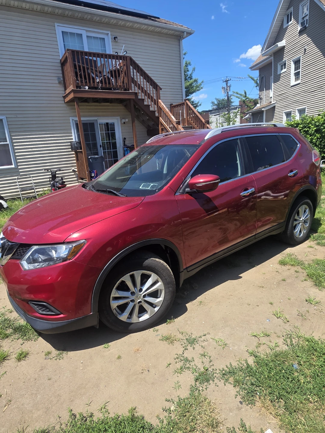 Red Nissan Rogue SV AWD