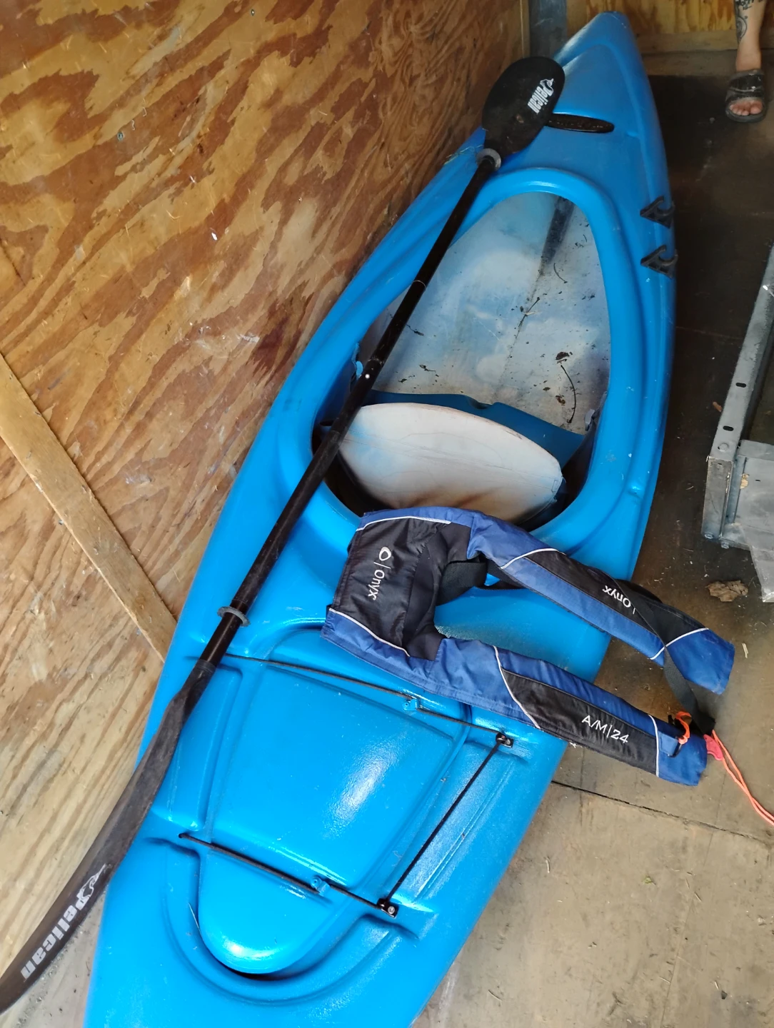 Kyak with life jacket and paddle