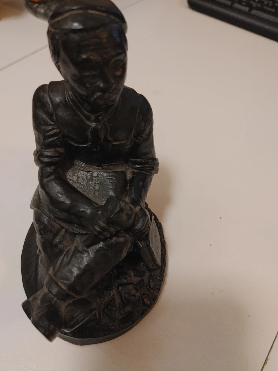 Wooden Figurine of a Person with a Child