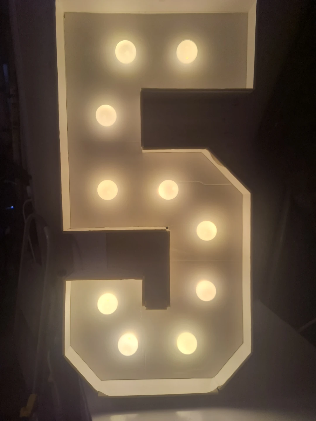 Light-up number 5 marquee sign
