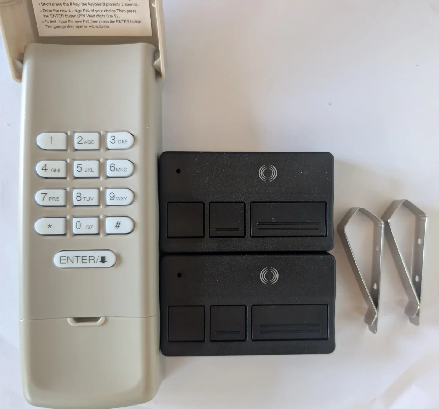 Brand New Wireless Garage Door Keypad and Pair of Remote Openers