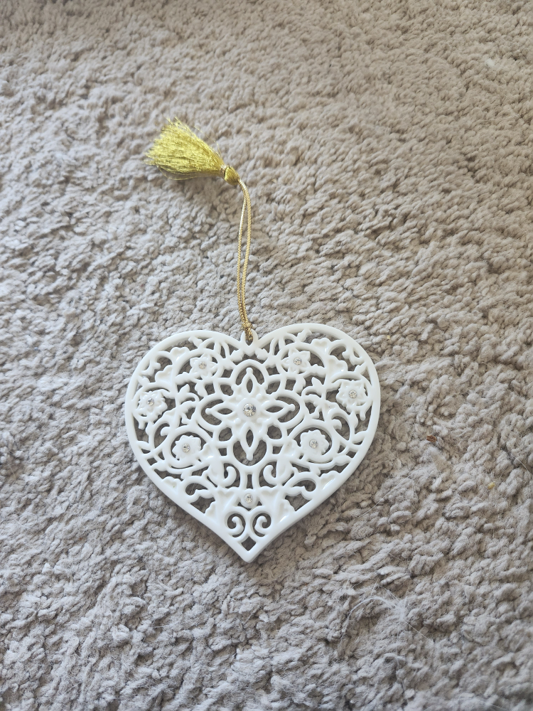 White heart ornament with rhinestones and gold tassel