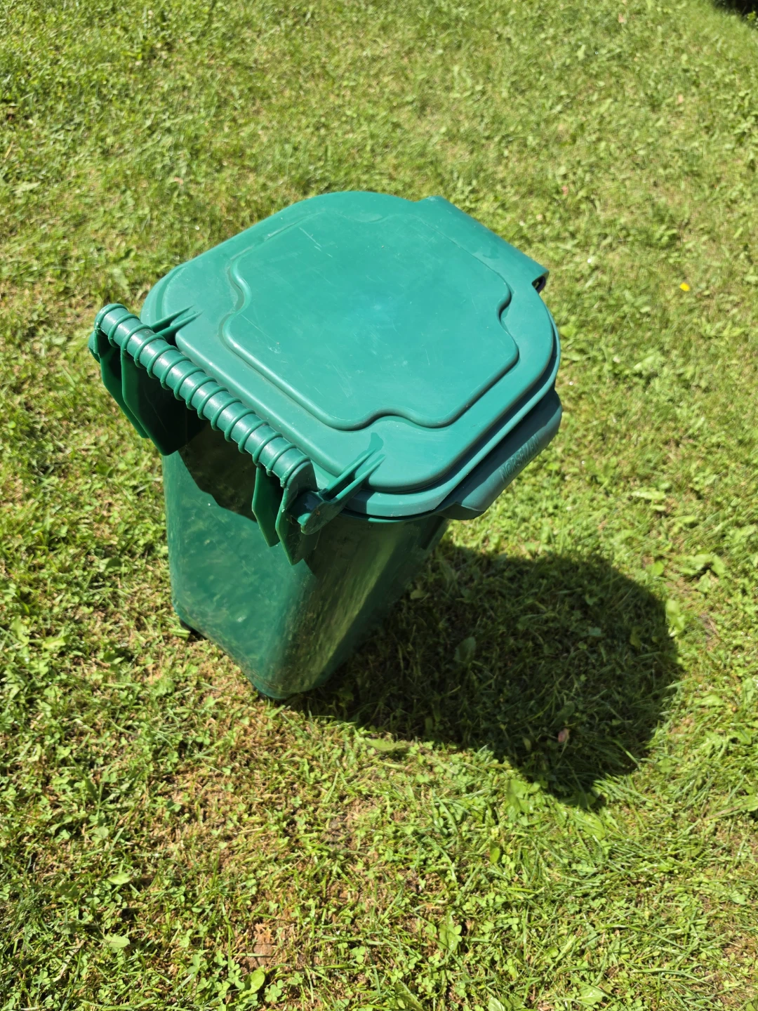 Durable green plastic compost bin with a locking lid and wheels. - photo 2