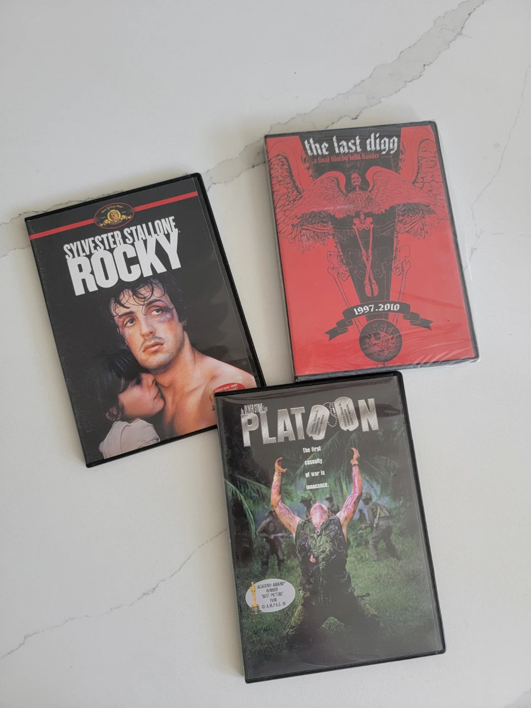 3 Movie DVD Bundle: Rocky, Platoon, and The Last Digg
