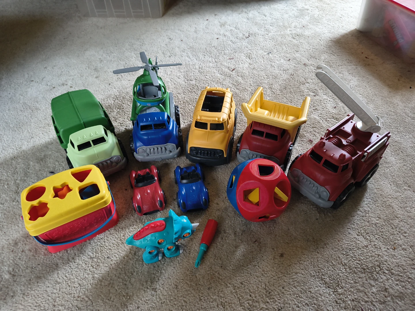Assorted Toy Vehicles and Shape Sorters