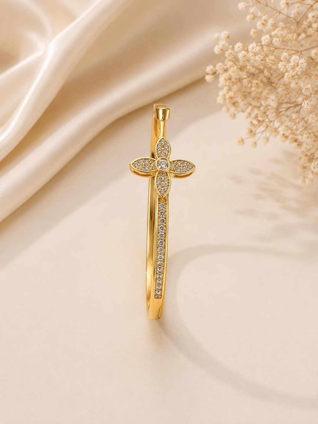 Gold Tone Bangle Bracelet with Crystal Embellishments