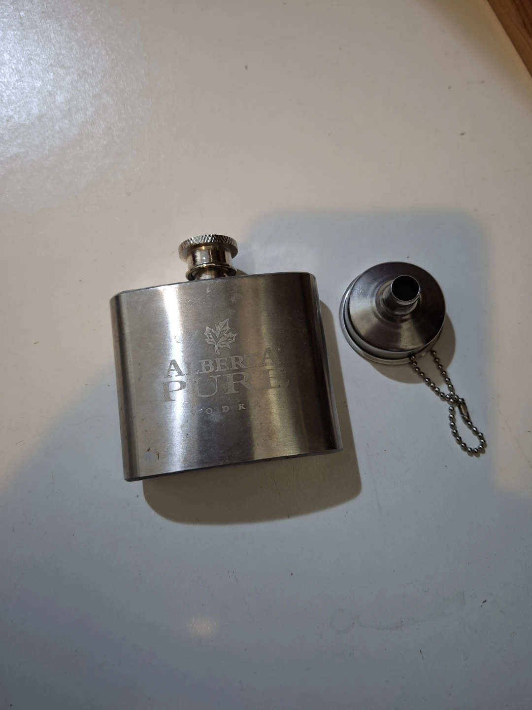 Alberta Pure Vodka Stainless Steel Flask with funnel.
