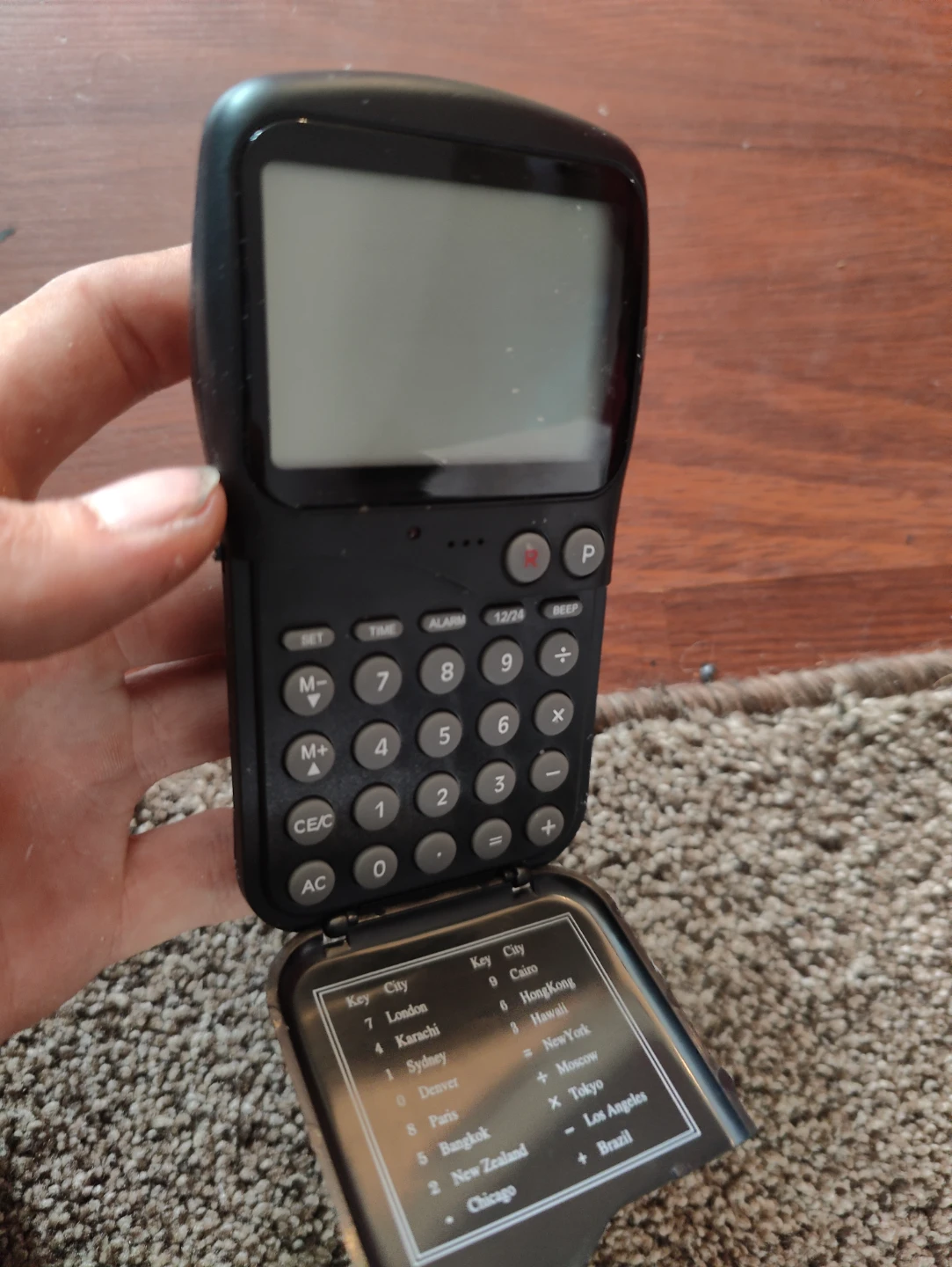 weird Calculator with World Cities and Alarm