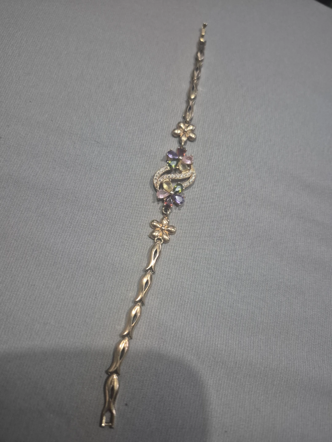 Gold-tone bracelet with colorful gemstones