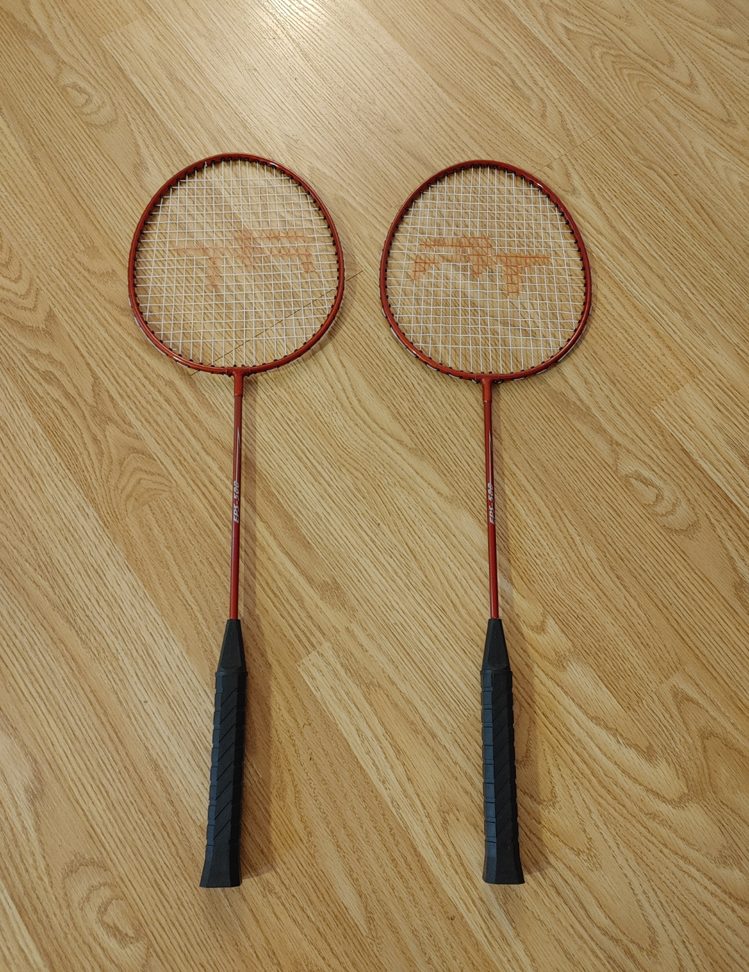 Two Red Badminton Racquets