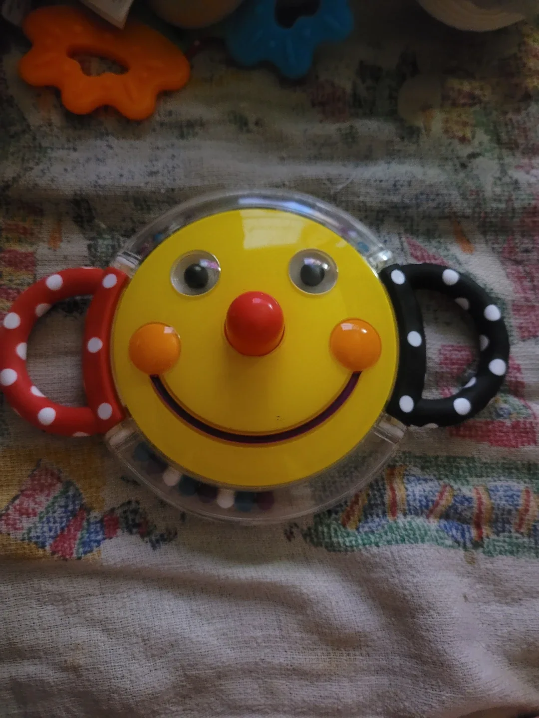 Sassy Smiley Face Mirror Rattle, Multicolour