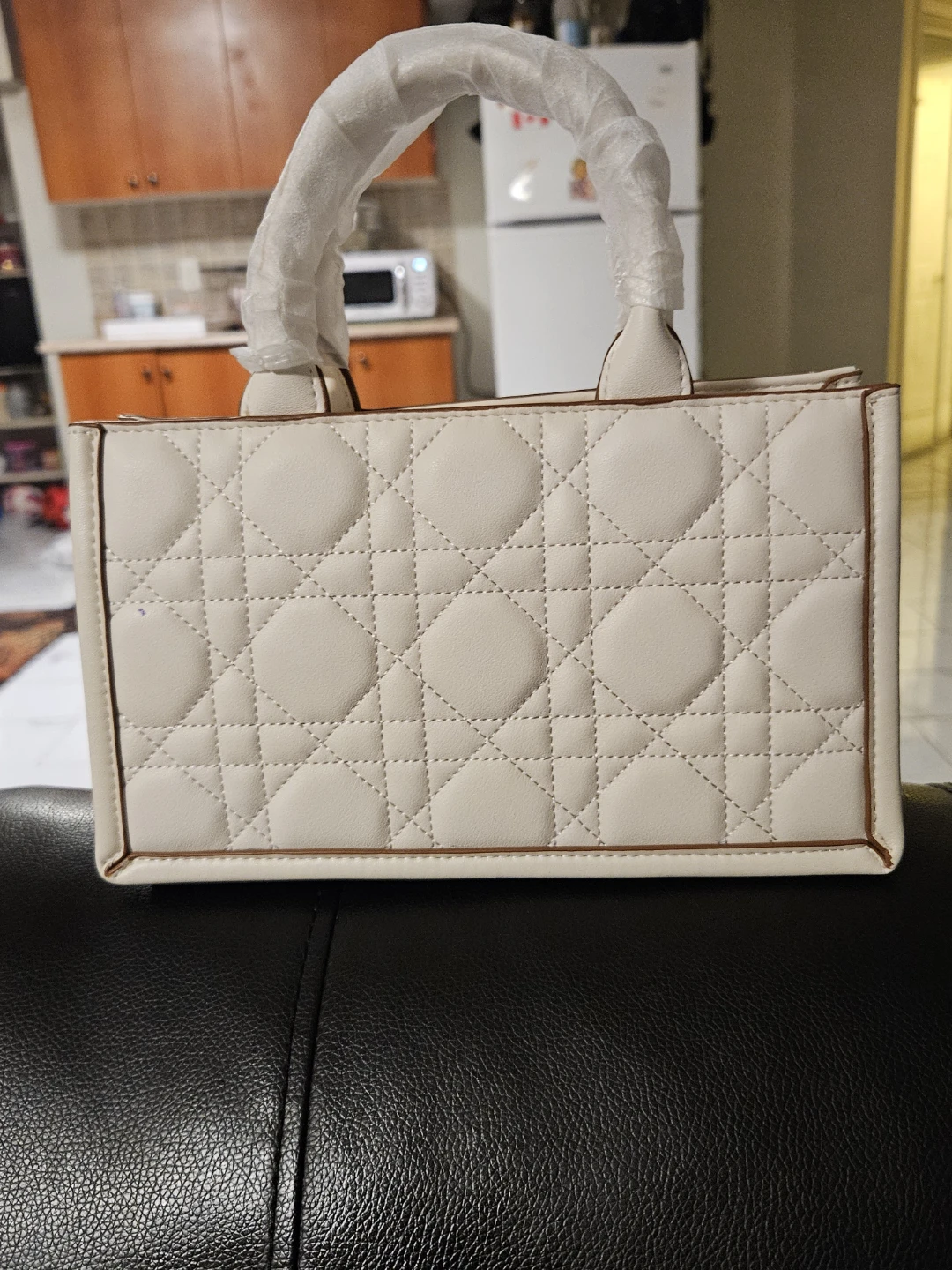 White Quilted Handbag with Gold Charm