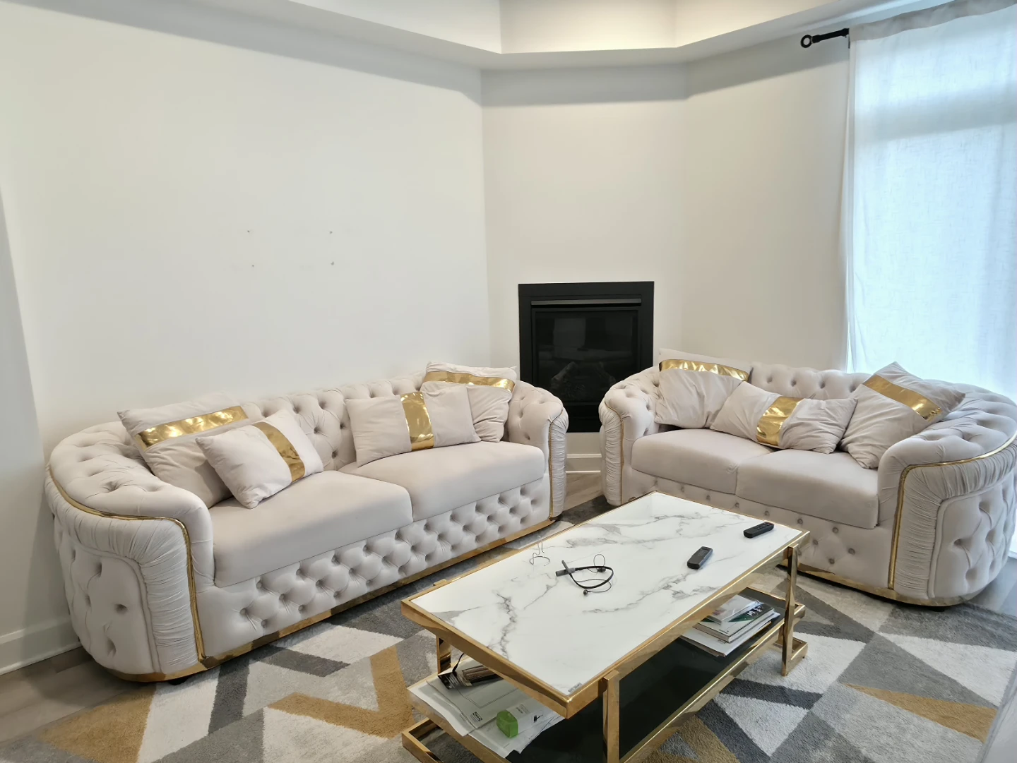 Tufted Sofa with Gold Accents