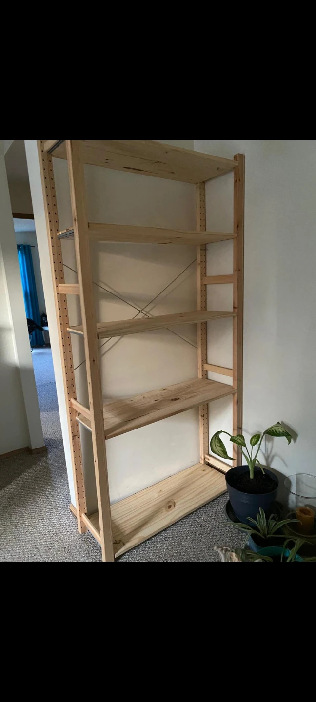 IKEA wooden shelving unit with five shelves