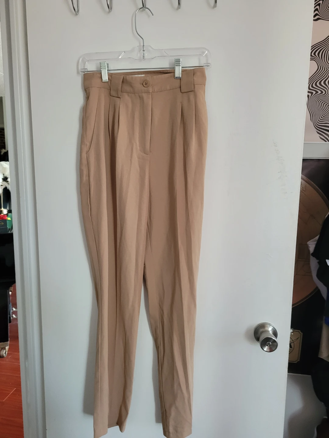Beige high-waisted pleated trousers