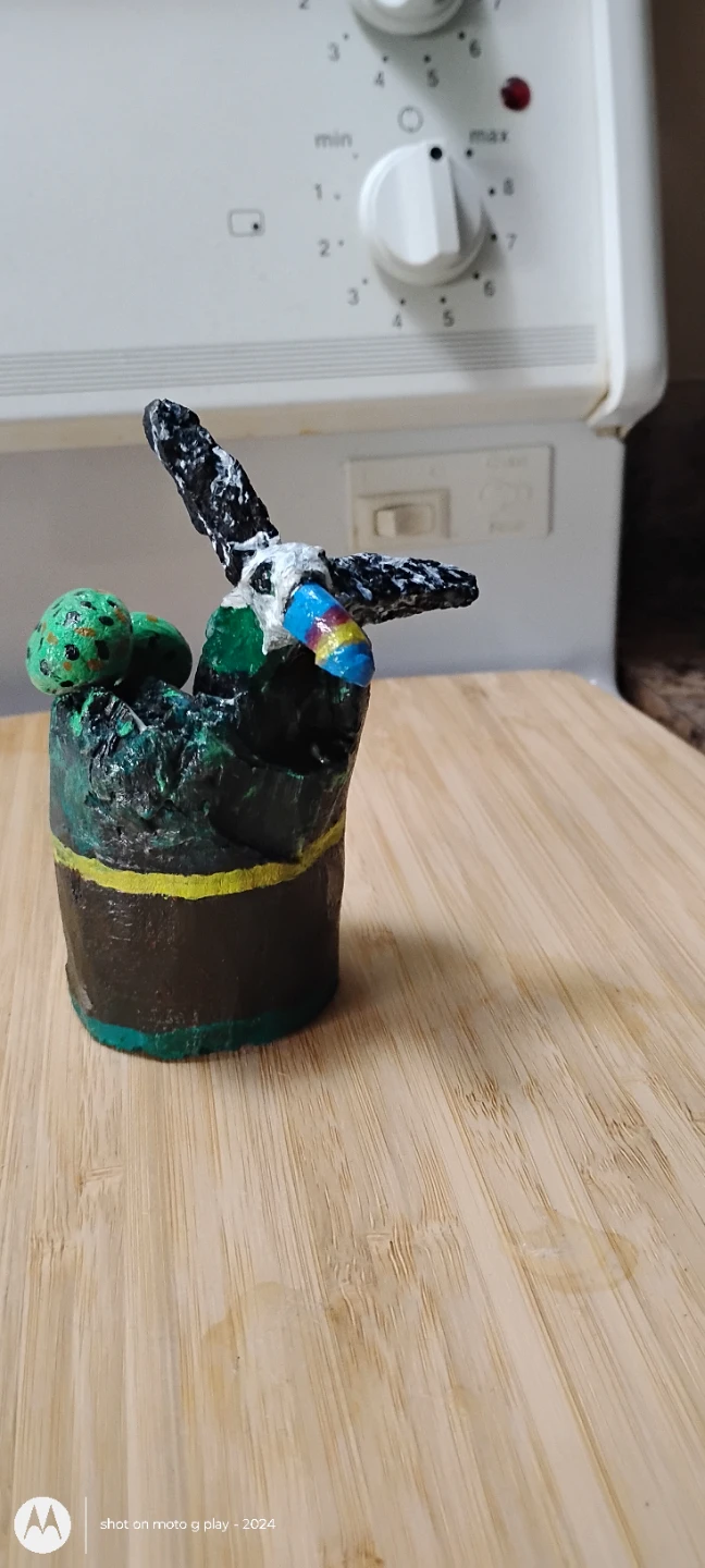 Hand crafted Tucan bird made of drift wood and stone