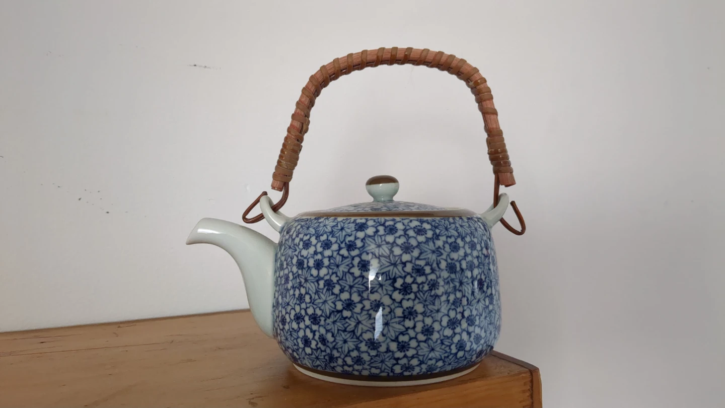 Blue Floral Ceramic Teapot with Woven Handle