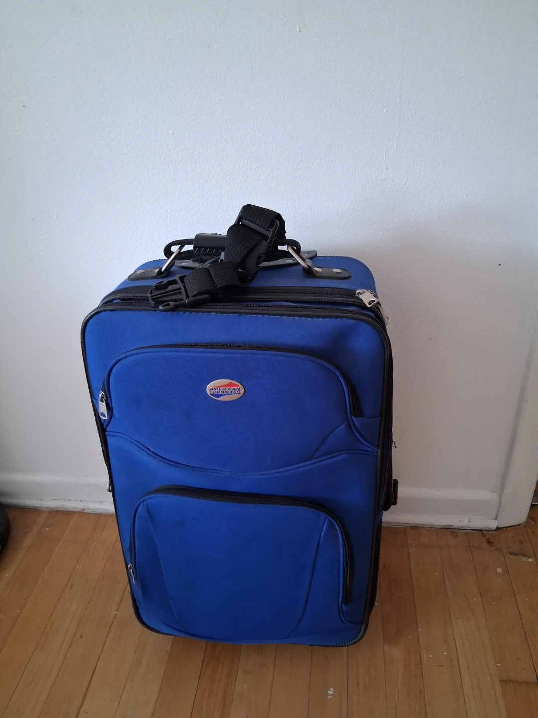 American Tourister Blue Rolling Suitcase